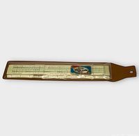 Slide rule inside brown vinyl sleeve showing Sterling sticker