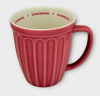 Front view of pink ribbed Starbucks mug