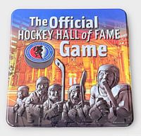 Front of tin showing title and relief hockey player graphics