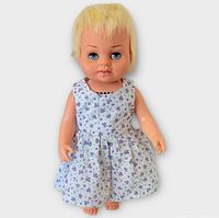 Front view of doll in dress showing overall condition