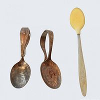Front view of three spoons showing style and materials