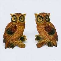 front view of the two matching chalkware owl plaques