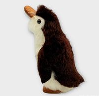 Left side view highlighting brown rabbit fur back and leather beak