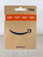 Front of sealed Amazon.ca $100 gift card in packaging