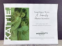 Front view of printed voucher showing family image and provider name