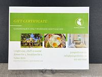 Full view of the Pangea House gift certificate on stand