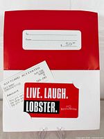 Gift card seated in envelope holder with activation receipt visible