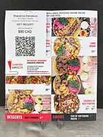 Gift receipt and printed menu page displayed on easel