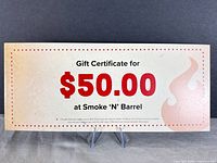 Front of $50 Smoke 'N' Barrel gift certificate showing denomination and branding