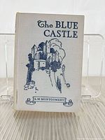 Front cover of cloth-bound book showing title and illustration