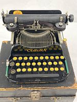 Corona No. 3 typewriter on top of case, keys and carriage visible