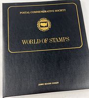 Front cover of black folio titled World of Stamps