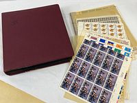 Album, loose sheets and sample full sheets laid out