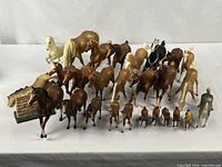 Group shot of entire lot of plastic horses