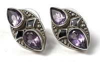 Front view of both sterling silver earrings showing amethyst stones and silver beadwork