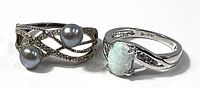 Both sterling silver rings side by side showing design elements
