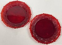 Both ruby red Cape Cod plates side by side