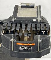 Top view of stenograph machine showing keys, logo, engraved nameplate