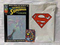 Front view showing comic, plastic bag, trading card