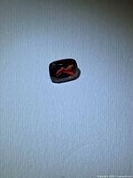 Top view of cushion-cut cherry red garnet