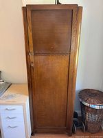 Full front view of oak wardrobe cabinet