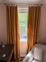 Full view of both curtain panels hung on rod