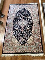 Full view of rug showing complete pattern and fringe