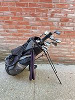 Full view of Wilson stand bag with clubs and extended legs
