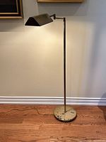 Full view of brass floor lamp, base to shade