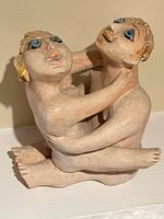 Front view of terracotta sculpture showing entwined figures