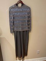 Full view of beaded jacket over long grey gown