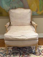 Front view showing full chair, frame, cushions, upholstery