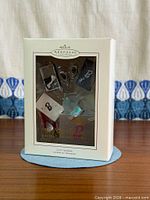 Front view of boxed Step Out in Style ornament set