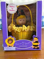 Front view of boxed Sunflower baby doll