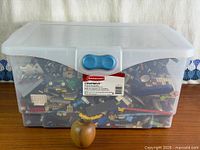 Full view of closed Rubbermaid Cleverstore tote filled with LEGO pieces
