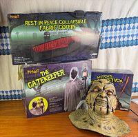 Group shot showing coffin box, Gatekeeper box, broomstick box, and latex zombie mask