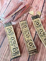 three carved ceramic incense holders, incense sticks, wooden tokens