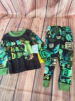Full view of top and pants laid flat