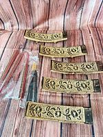 Five ceramic gold leaf-pattern incense holders and three bundles of incense sticks