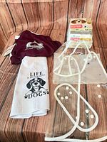 Overview showing jersey, sealed diaper pack, towel, clear raincoat pieces