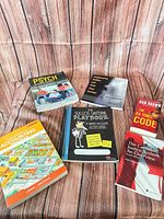 All six books laid out showing covers