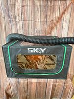Front view showing SKGY logo, window and attached ventilation hose