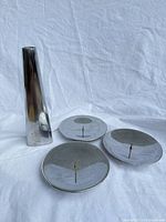 Overall view of three drip plates and triangular stand