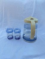 Front view of glass jug and two glasses