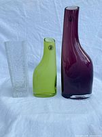 Front view of three vases showing colors, shapes, labels