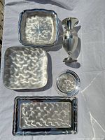 Top view of all five silver-plated pieces