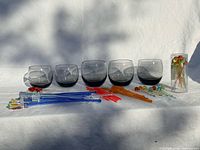 Full lot showing 5 tumblers and assortment of stir sticks