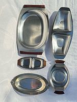 group shot of all six stainless steel dishes and trays