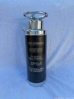 Front view showing "Thirst Extinguisher" graphics and overall form