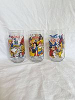 Front view of all three Disney promotional glasses